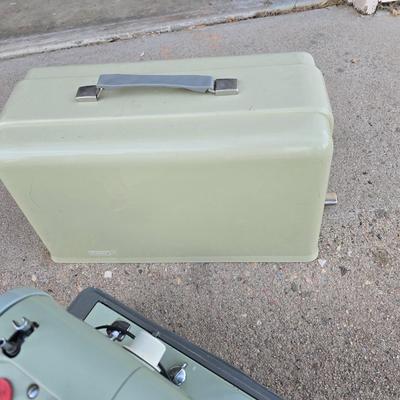 Vintage Sears Kenmore sewing machine with small tote of sewing supplies