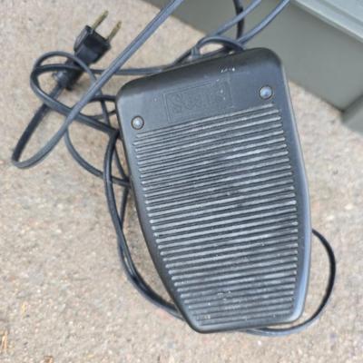 Vintage Sears Kenmore sewing machine with small tote of sewing supplies