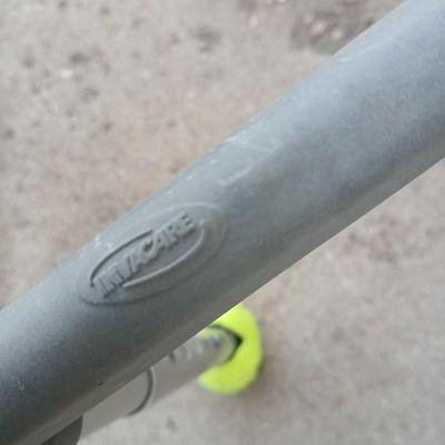 Mobility walker with a London fog umbrella