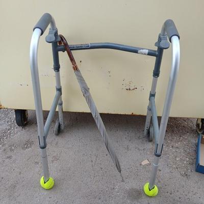 Mobility walker with a London fog umbrella