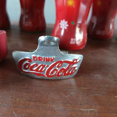 New CocaCola Starr bottle opener with a collection of glass Santa & Broncos coke bottles