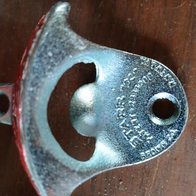 New CocaCola Starr bottle opener with a collection of glass Santa & Broncos coke bottles