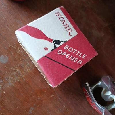 New CocaCola Starr bottle opener with a collection of glass Santa & Broncos coke bottles