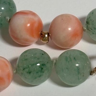 LOT 272: Pink Tourmaline & Jade Bead Necklace w/14K Clasp, 3 Strand Beaded Coral Necklace w/14K Clasp & Gold Tone Bangle Bracelet