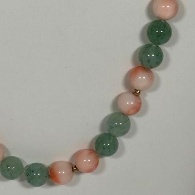 LOT 272: Pink Tourmaline & Jade Bead Necklace w/14K Clasp, 3 Strand Beaded Coral Necklace w/14K Clasp & Gold Tone Bangle Bracelet