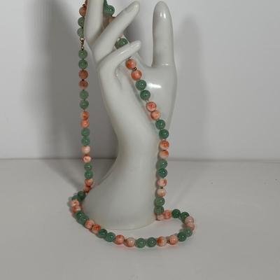 LOT 272: Pink Tourmaline & Jade Bead Necklace w/14K Clasp, 3 Strand Beaded Coral Necklace w/14K Clasp & Gold Tone Bangle Bracelet