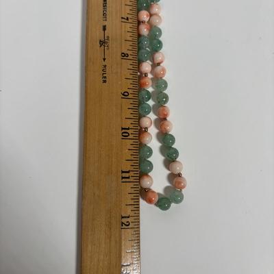 LOT 272: Pink Tourmaline & Jade Bead Necklace w/14K Clasp, 3 Strand Beaded Coral Necklace w/14K Clasp & Gold Tone Bangle Bracelet