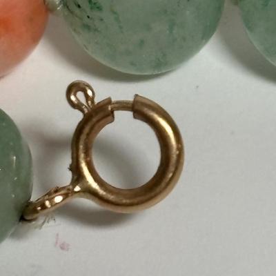 LOT 272: Pink Tourmaline & Jade Bead Necklace w/14K Clasp, 3 Strand Beaded Coral Necklace w/14K Clasp & Gold Tone Bangle Bracelet