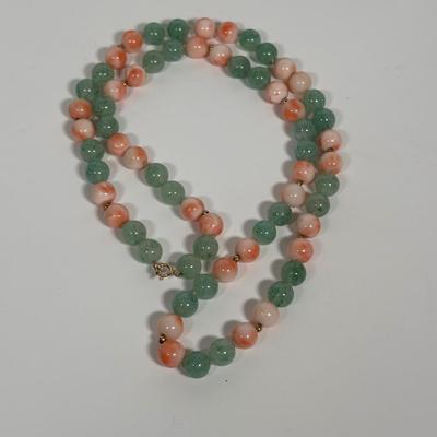 LOT 272: Pink Tourmaline & Jade Bead Necklace w/14K Clasp, 3 Strand Beaded Coral Necklace w/14K Clasp & Gold Tone Bangle Bracelet