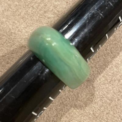 Green stone dolphin and jade ring