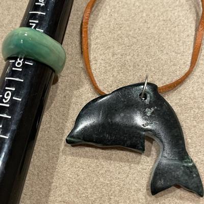 Green stone dolphin and jade ring