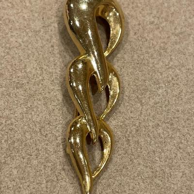 Gold and silver tone brooches