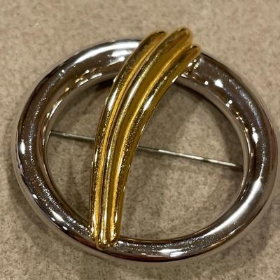 Gold and silver tone brooches