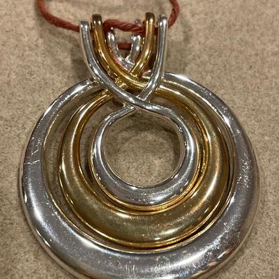 Gold and silver tone brooches