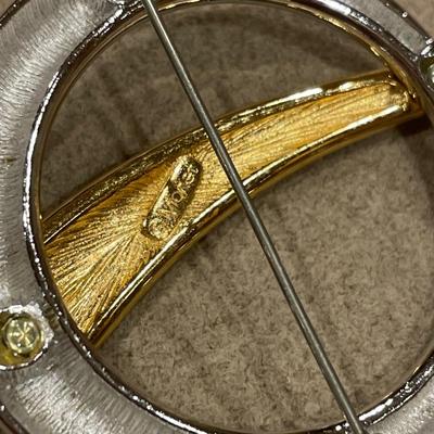 Gold and silver tone brooches