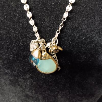 CHARM NECKLACE, GOLD TONE RING SIZE 5 AND A PAIR OF EARRINGS