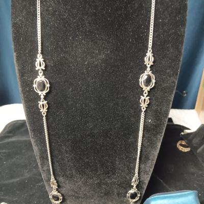 SILVER TONE NECKLACE AND PENDANT NECKLACES WITH BLACK STONES PLUS A SILVER TONE RING SIZE 8