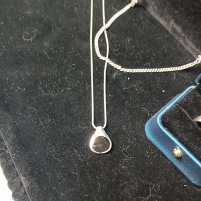 SILVER TONE NECKLACE AND PENDANT NECKLACES WITH BLACK STONES PLUS A SILVER TONE RING SIZE 8