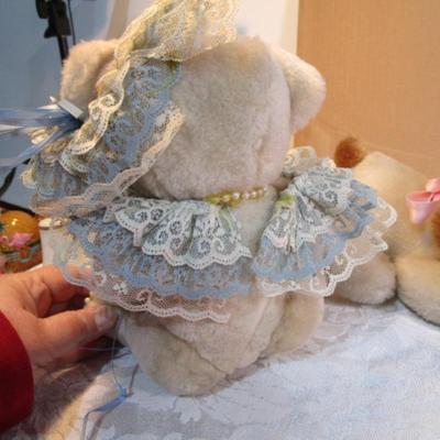 Stuffed musical dog with puppy, dressed stuffed bear