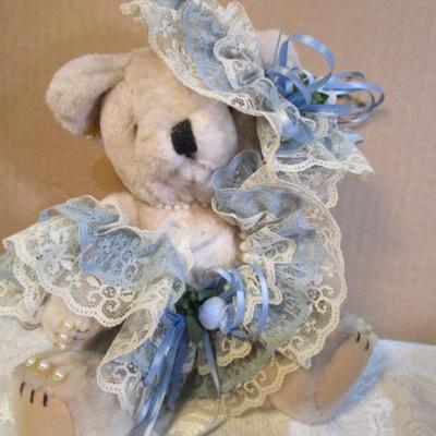 Stuffed musical dog with puppy, dressed stuffed bear