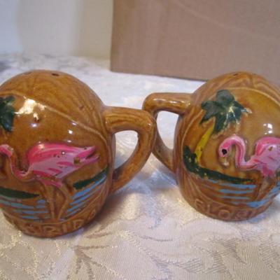 2 shot glasses, 1 set of salt & pepper shakers, 2 matching pepper shakers, 2 shells