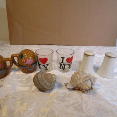 2 shot glasses, 1 set of salt & pepper shakers, 2 matching pepper shakers, 2 shells