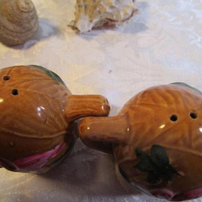 2 shot glasses, 1 set of salt & pepper shakers, 2 matching pepper shakers, 2 shells