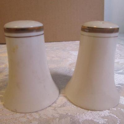 2 shot glasses, 1 set of salt & pepper shakers, 2 matching pepper shakers, 2 shells