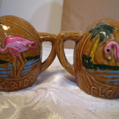 2 shot glasses, 1 set of salt & pepper shakers, 2 matching pepper shakers, 2 shells