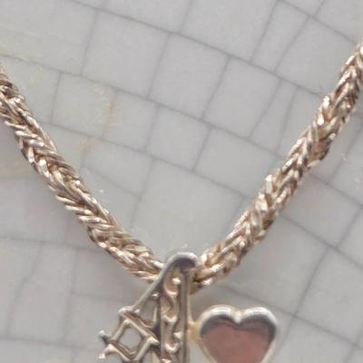 LOT 40: 18 inch Sterling Silver Chain with Grandmother and Grandchildren Charms 12.2gtw