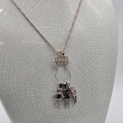 LOT 40: 18 inch Sterling Silver Chain with Grandmother and Grandchildren Charms 12.2gtw