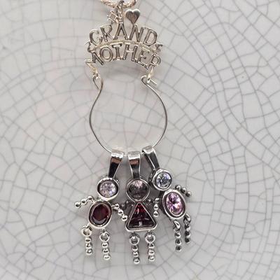 LOT 40: 18 inch Sterling Silver Chain with Grandmother and Grandchildren Charms 12.2gtw