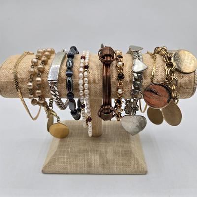 LOT 50: Variety of Bracelets, ten commandments charm bracelet & more