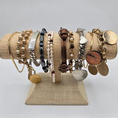 LOT 50: Variety of Bracelets, ten commandments charm bracelet & more