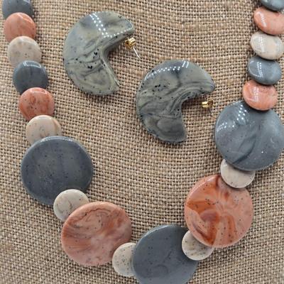 LOT 52: Four Necklace and Earrings Sets