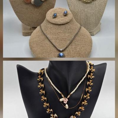 LOT 52: Four Necklace and Earrings Sets
