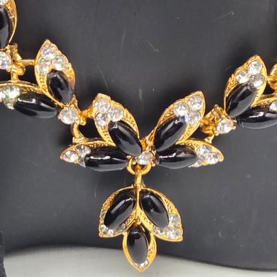 LOT 52: Four Necklace and Earrings Sets