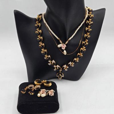 LOT 52: Four Necklace and Earrings Sets