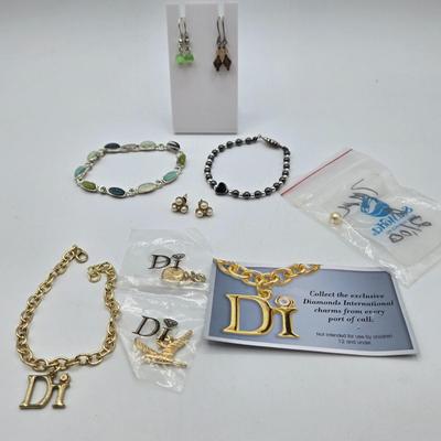 LOT 57: Assortment of Bracelets, Earrings, and Charms