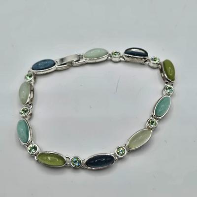 LOT 57: Assortment of Bracelets, Earrings, and Charms