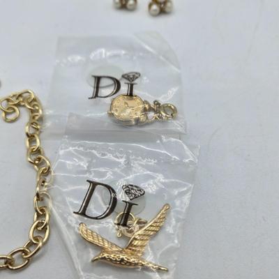 LOT 57: Assortment of Bracelets, Earrings, and Charms