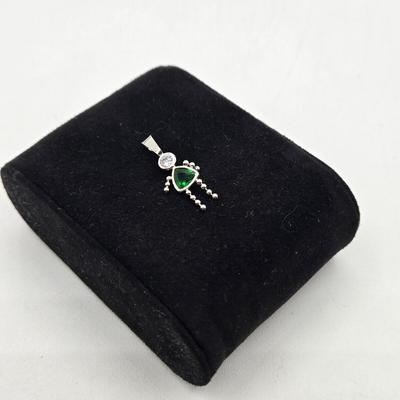 LOT 59: 14k White Gold Charm/0.7gtw