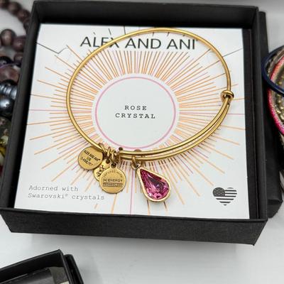 LOT 100: Alex and Ani Charm Bracelets w/ Boxes, Bangles & Beaded Bracelets