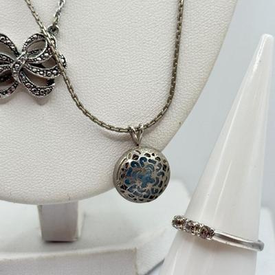 LOT 105: Avon Sterling and Glass Ring (sz 9), Avon Earrings in Box, Faux Marcasite Pieces & More