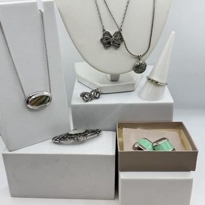 LOT 105: Avon Sterling and Glass Ring (sz 9), Avon Earrings in Box, Faux Marcasite Pieces & More