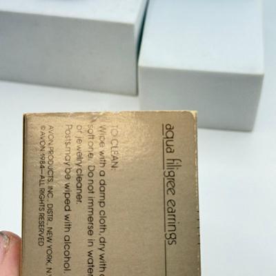 LOT 105: Avon Sterling and Glass Ring (sz 9), Avon Earrings in Box, Faux Marcasite Pieces & More