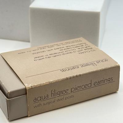 LOT 105: Avon Sterling and Glass Ring (sz 9), Avon Earrings in Box, Faux Marcasite Pieces & More