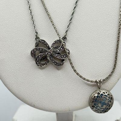 LOT 105: Avon Sterling and Glass Ring (sz 9), Avon Earrings in Box, Faux Marcasite Pieces & More