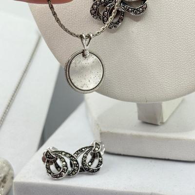 LOT 105: Avon Sterling and Glass Ring (sz 9), Avon Earrings in Box, Faux Marcasite Pieces & More