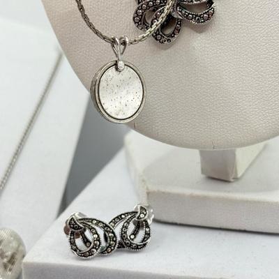 LOT 105: Avon Sterling and Glass Ring (sz 9), Avon Earrings in Box, Faux Marcasite Pieces & More